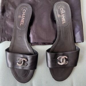 Authentic CHANEL Black Leather Slide Sandals
Size 39.5 EU fits U.S. size 8.5-9.5